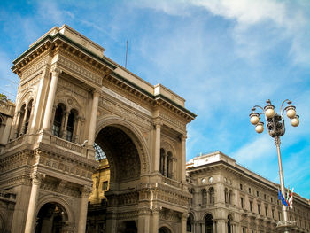 Low angle view of historical building against cloudy sky