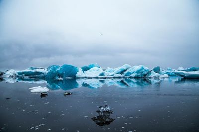 Scenic view of frozen sea against sky