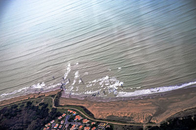 Aerial view of beach and mountain against sky