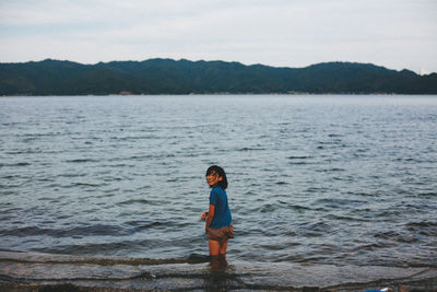 Woman standing in water