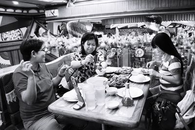 People at market stall