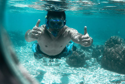 Man swimming in sea