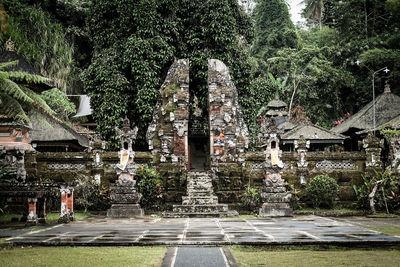 Exterior of old historic temple against trees