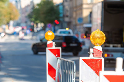 Close-up of road sign on street in city