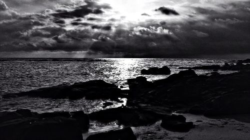 Scenic view of sea against cloudy sky