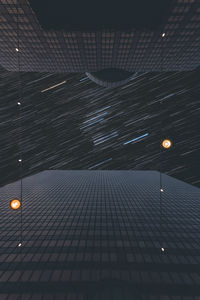 Low angle view of illuminated lights at night