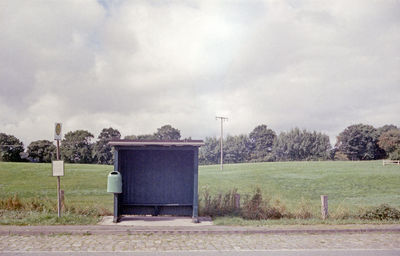 Built structure on countryside landscape against sky