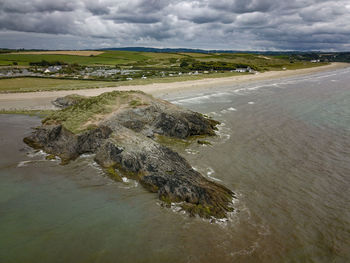 Scenic view of sea shore against sky