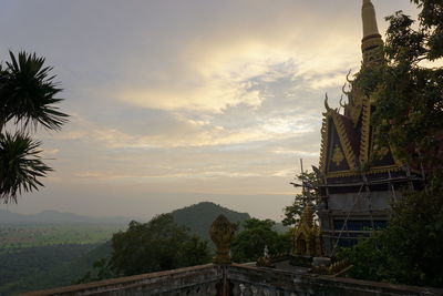 View of temple against building