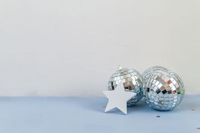 Close-up of decoration on table against white background