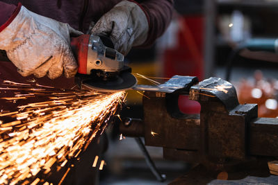 Man working on metal machine