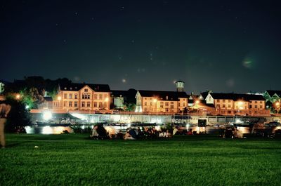 View of buildings in city at night