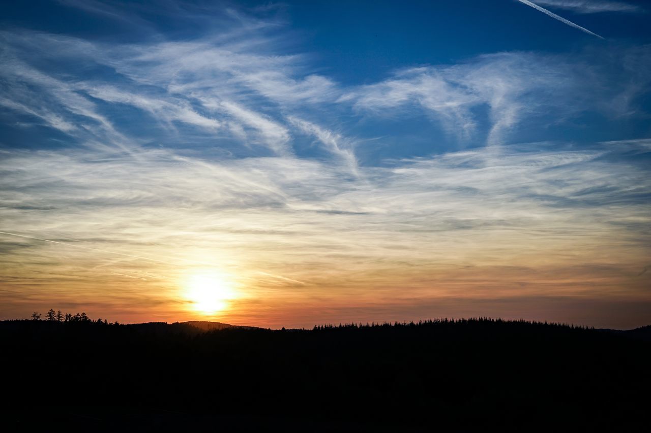 SILHOUETTE OF LANDSCAPE AT SUNSET