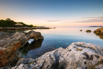 Scenic view of sea against sky during sunset