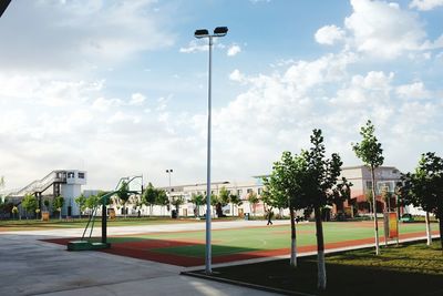 View of soccer field against cloudy sky