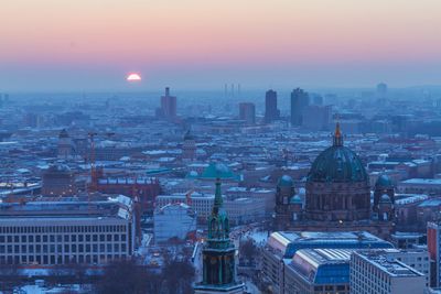 High angle view of city at sunset