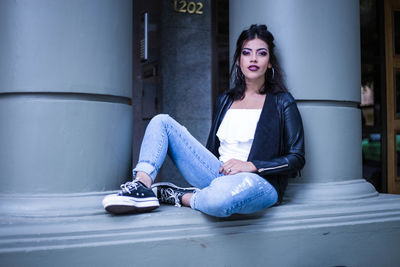 Young woman sitting outdoors