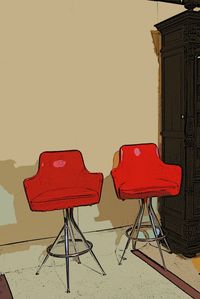 Empty chairs against wall at home