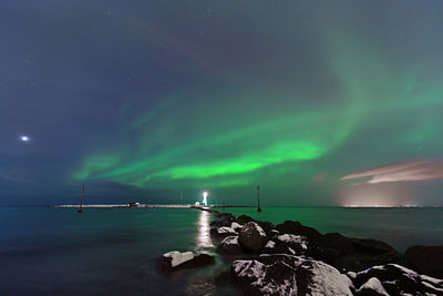 Scenic view of sea against sky at night