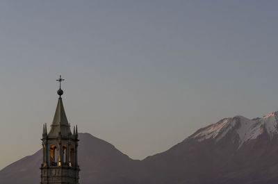 Basilica cathedral of arequipa against mountains at dusk