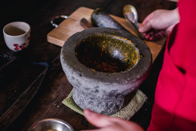 Close-up of person preparing food on table