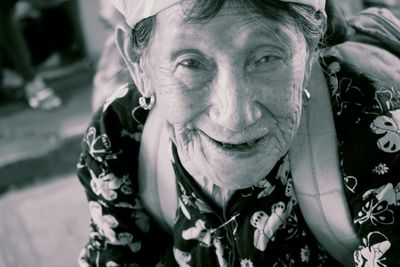 Close-up portrait of smiling senior woman