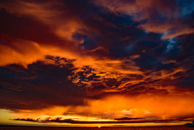 Low angle view of dramatic sky during sunset