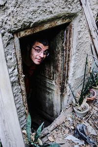 Portrait of woman in old abandoned building