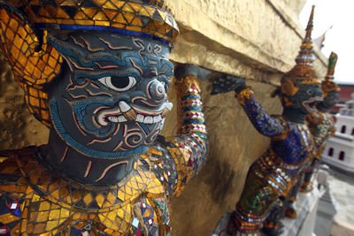 Close-up of statues by pagoda