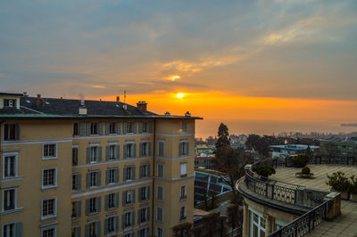 High angle view of buildings against sky during sunset