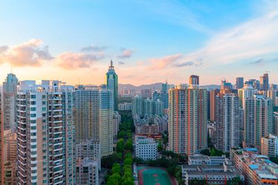 Modern buildings in city against sky