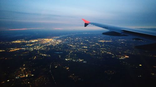 Aerial view of airplane wing against sky