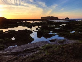 Scenic view of sea against sky during sunset