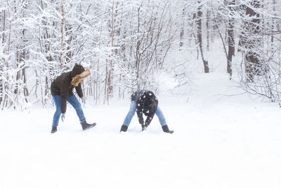 People walking on snow covered land