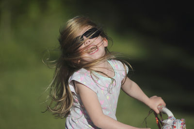 Girl riding bike in park