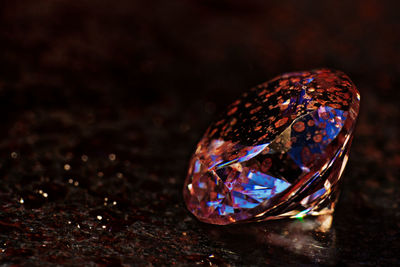 Close-up of a ring with reflection of black background