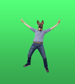 Digital composite image of young man jumping against green background