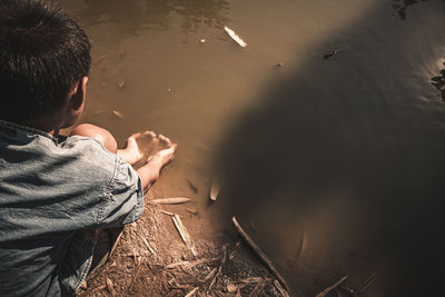 Rear view of man in lake