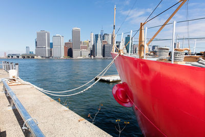 Boats moored in city at waterfront