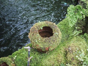 High angle view of rusty metal by lake