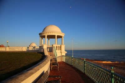 View of sea against clear blue sky