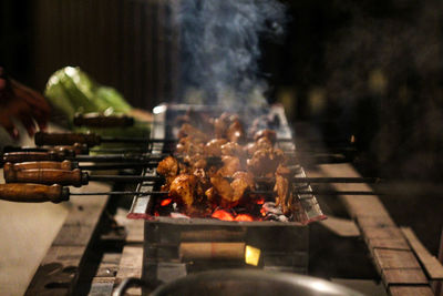 Close-up of meat on barbecue grill