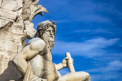 Low angle view of statue against sky