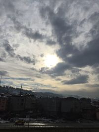 Townscape against sky at sunset