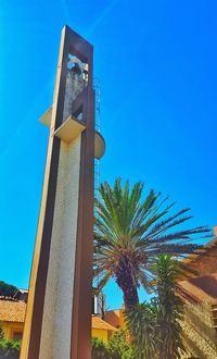 Low angle view of built structure against clear blue sky