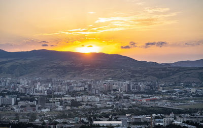 High angle view of townscape against sky during sunset