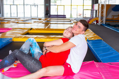 Rear view of couple sitting on couch