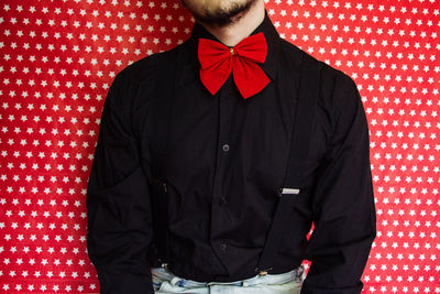 Midsection of man wearing suspenders