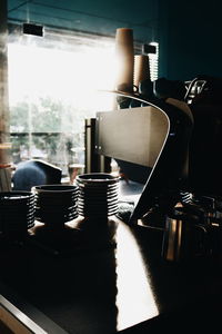 Close-up of electric lamp on table at home