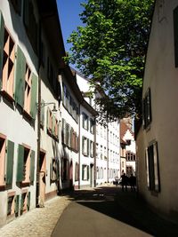 Street amidst buildings in city against sky
